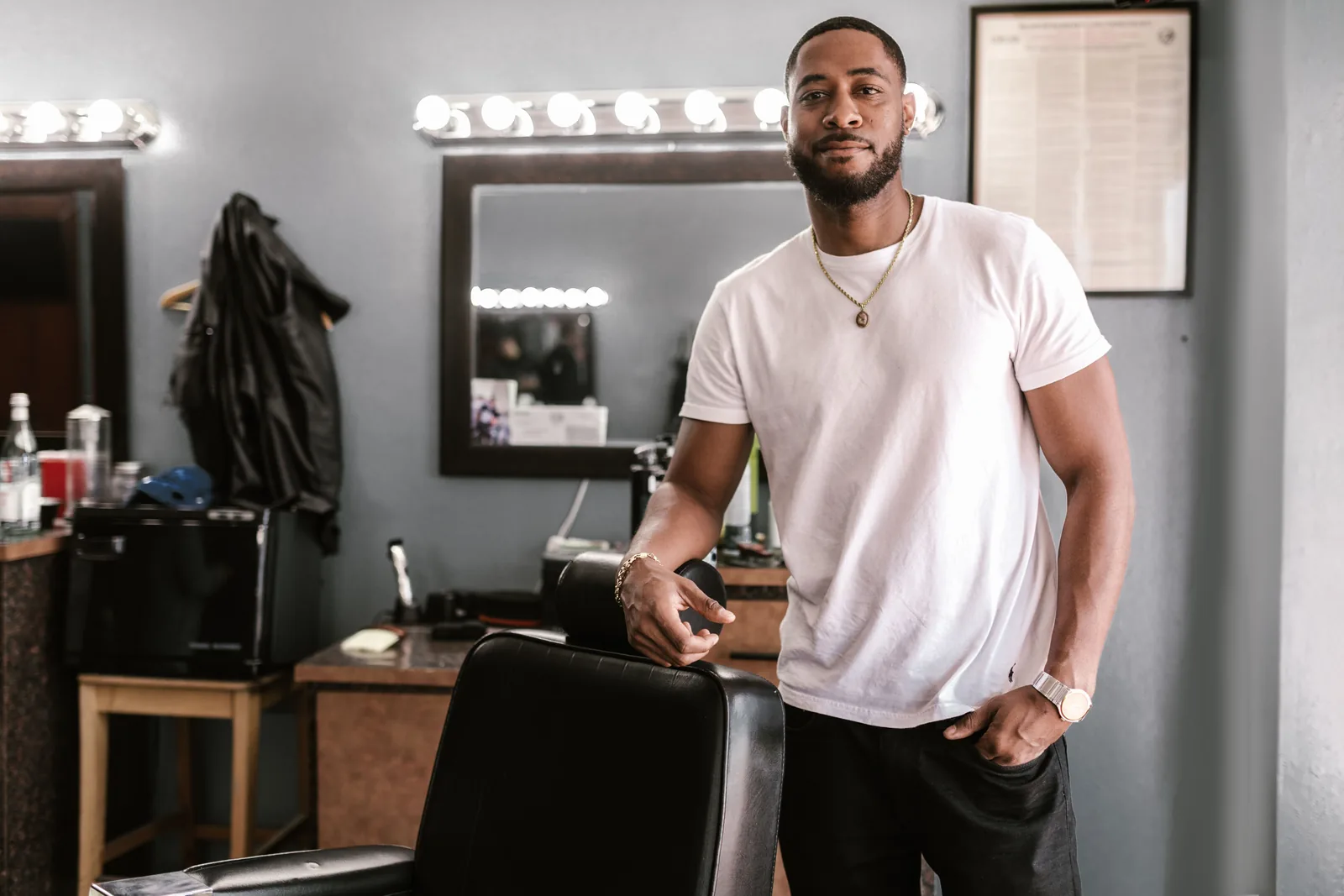 Portrait of Ellis Ward, a fictional barber in the BLACKLINE demonstration shop.