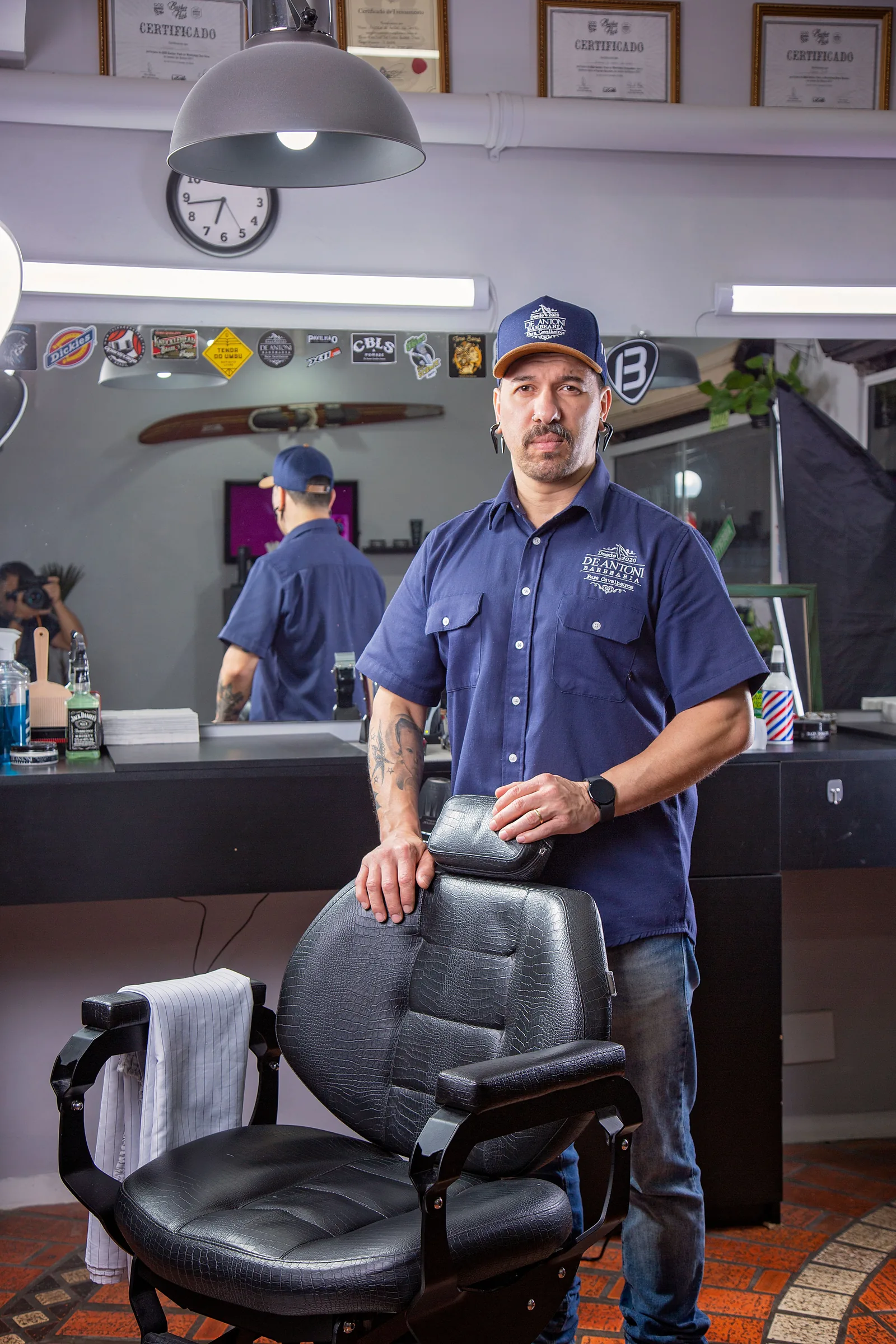 Portrait of Marcus Bell, a fictional barber in the BLACKLINE demonstration shop.
