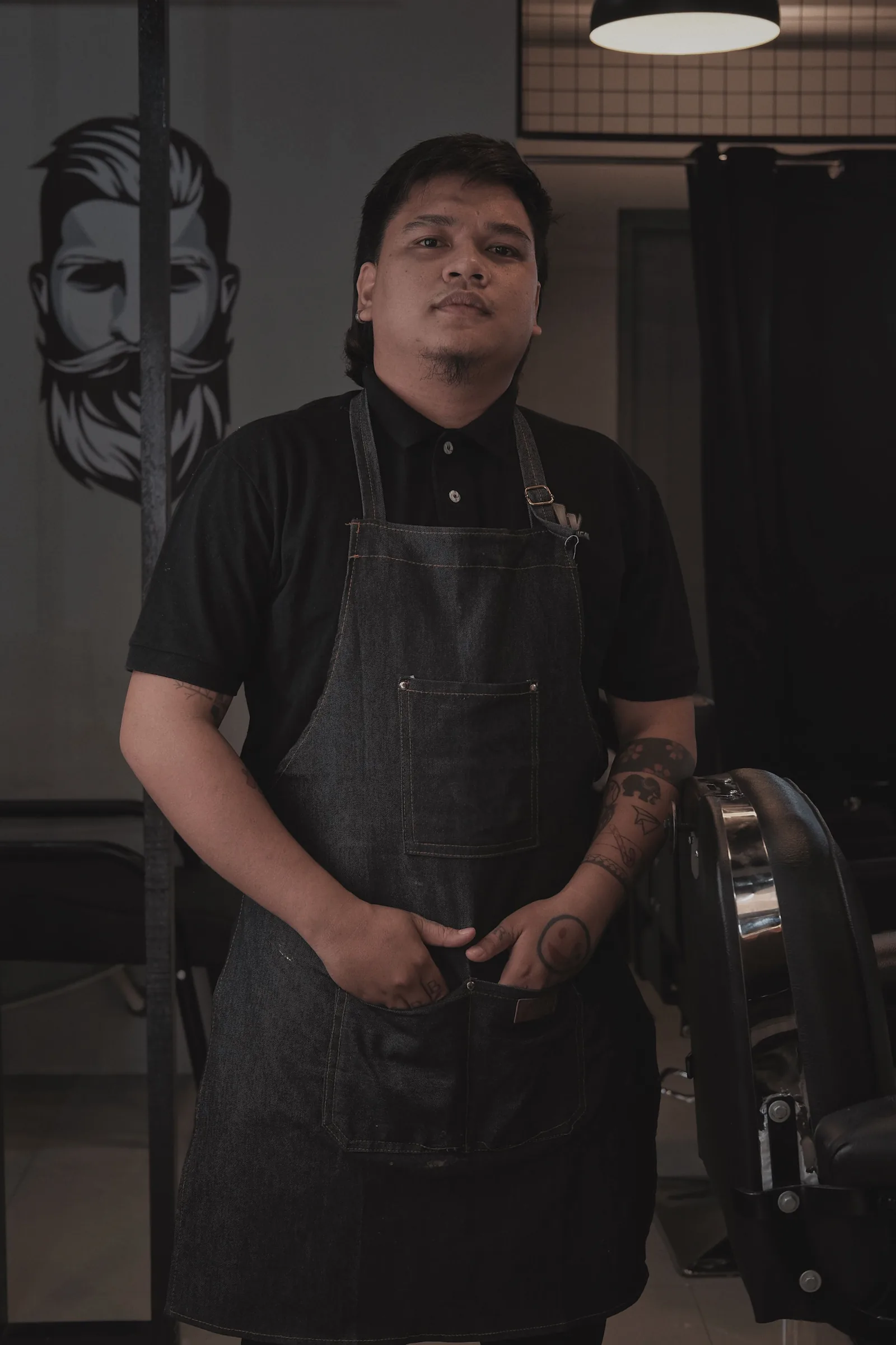 Portrait of Noah Reid, a fictional barber in the BLACKLINE demonstration shop.