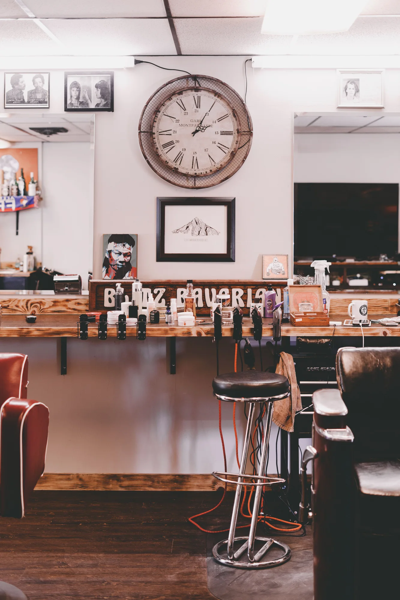 Detail of a fictional barbershop workstation, chairs and tools.